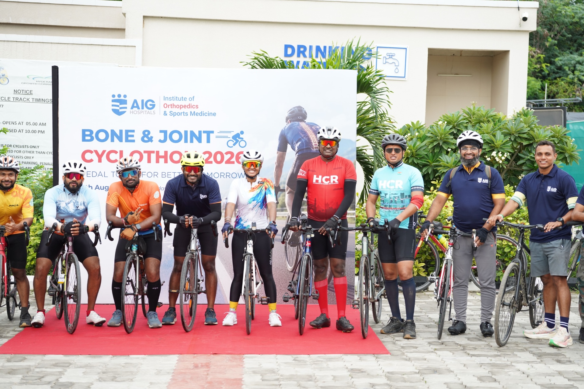 Riders lined up with bicycles at a cyclothon start line